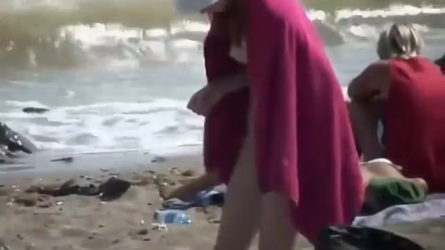 Nude teenage girl wrapped in a towel