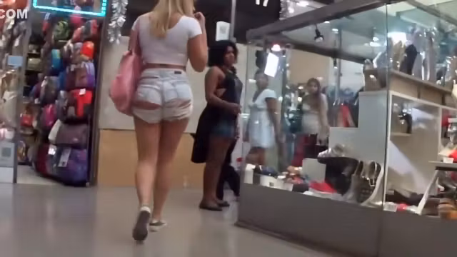 Blonde looks seductive in torn shorts