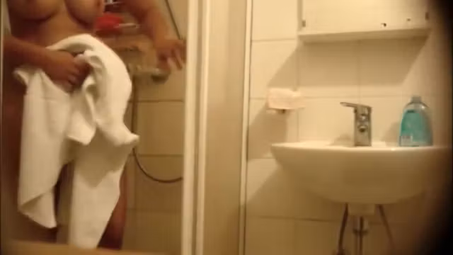 Seductive honey unveils her body before taking a shower