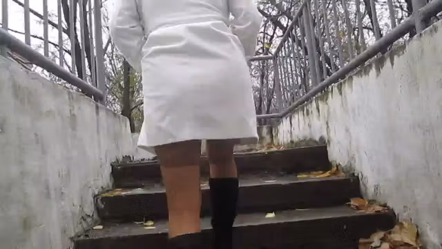 Girl flashing tan stockings going upstair