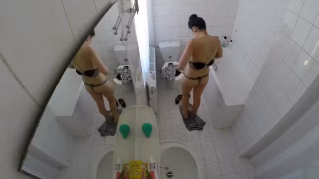 Beautiful housewife removes her clothes in order to wash her juicy holes