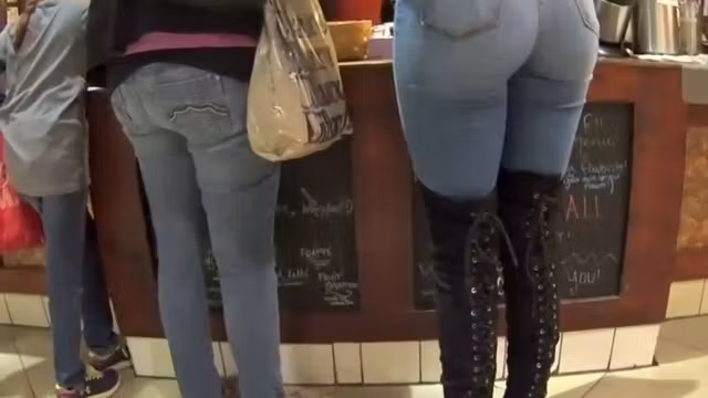 Perfect girl in tight jeans and high boots