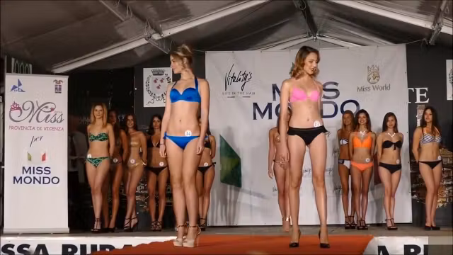 Beautiful models move on the catwalk in flimsy bikinis