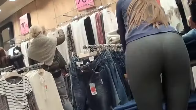 Sexy store clerk in tight leggings