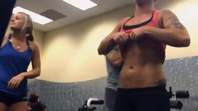 Fitness girls comparing muscles