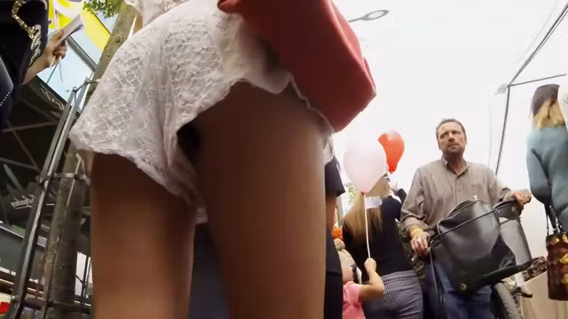 Following and peeping up her shorts