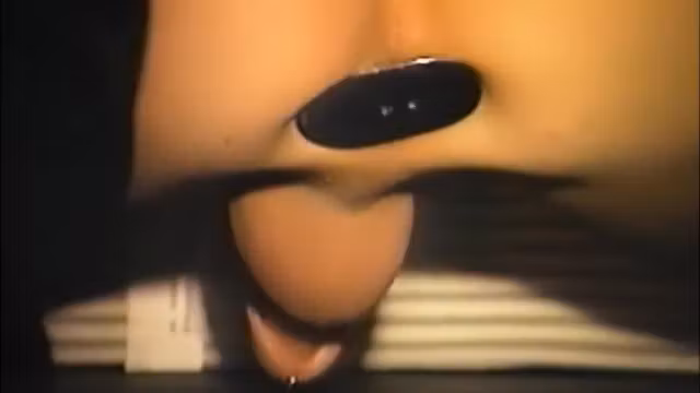 Two mans make out as their asses are filled to the limit in a banana contest