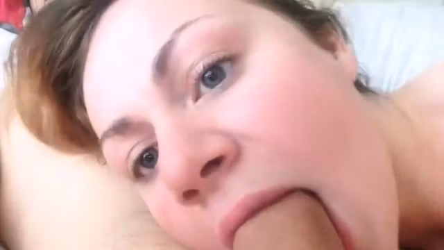 Sexy blue-eyed wife giving blowjob