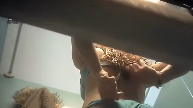 Busty girl gets dressed in the cabin
