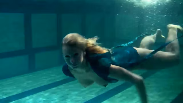 Blonde Feher with big firm tits underwater