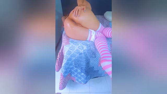 Thick Latina Bombshell In Pink Stockings Side View