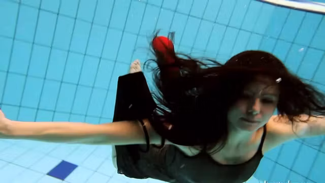 Big tits Kristy naked swimming pool action