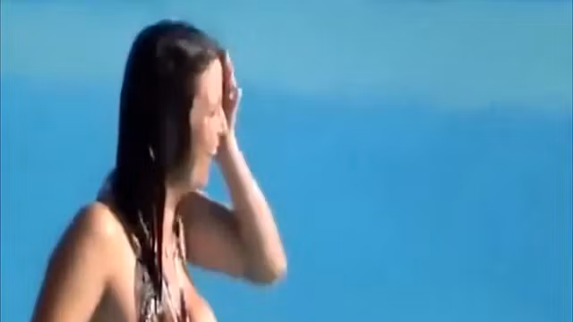 Busty girl's tit pops out while she was going down the waterslide