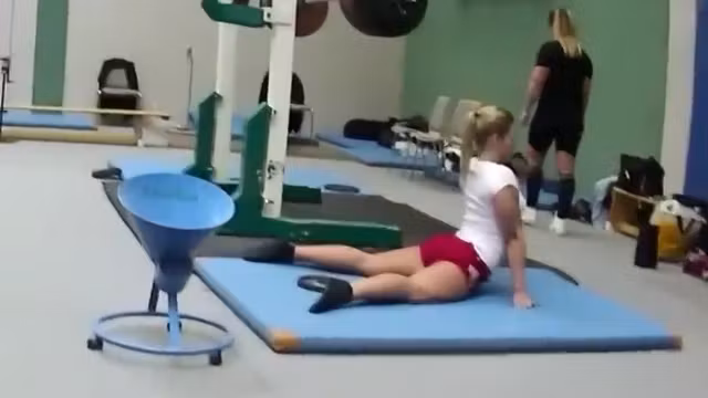 Sexy weightlifter girl during workout