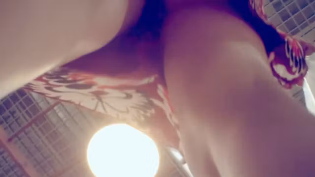Peeping under a short jeans skirt