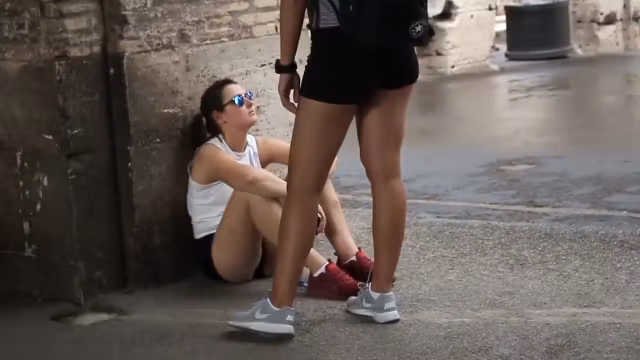 Pretty teen 18+ girl sitting on the floor