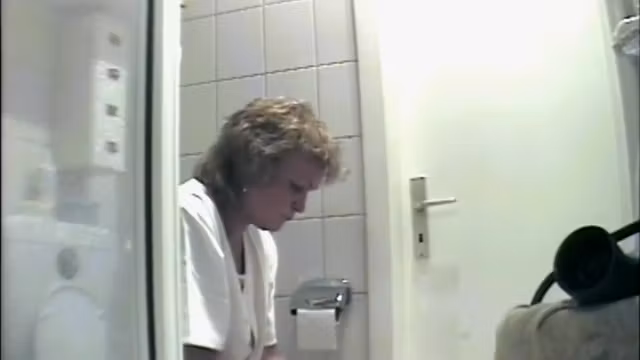 Mature is being filmed when urinating in the bathroom