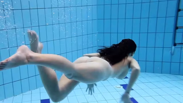 Sexy babe Aneta swims and strips naked