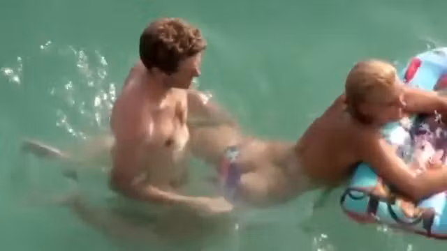 Guy trying to fuck her in the water