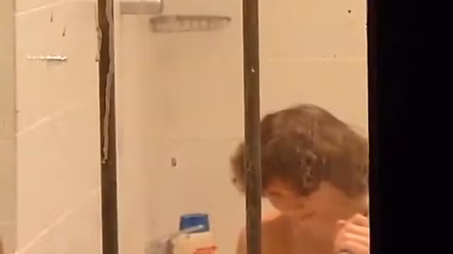 Mature lady peeped on in a bathroom