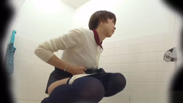 This glorious Asian babe was spied on by an while taking a piss in public toilet