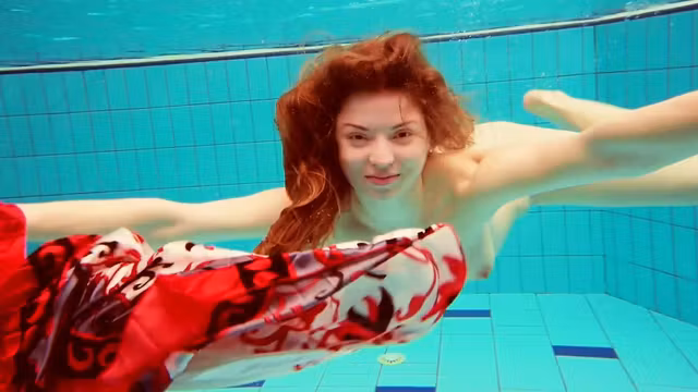 Hot Polish redhead swimming in the pool