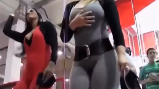 Stacked models in tight suits enjoy making their booties shake