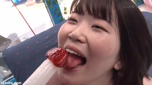 She makes him lick a penis-shaped candy, then strips naked and thrusts the real thing into him.
