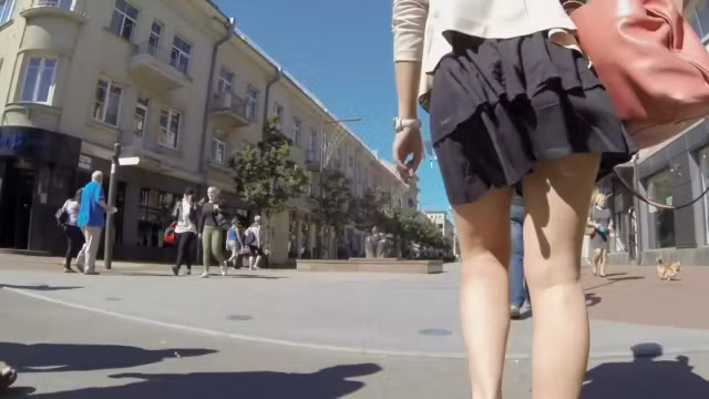 Summer breeze lifts milf's skirt